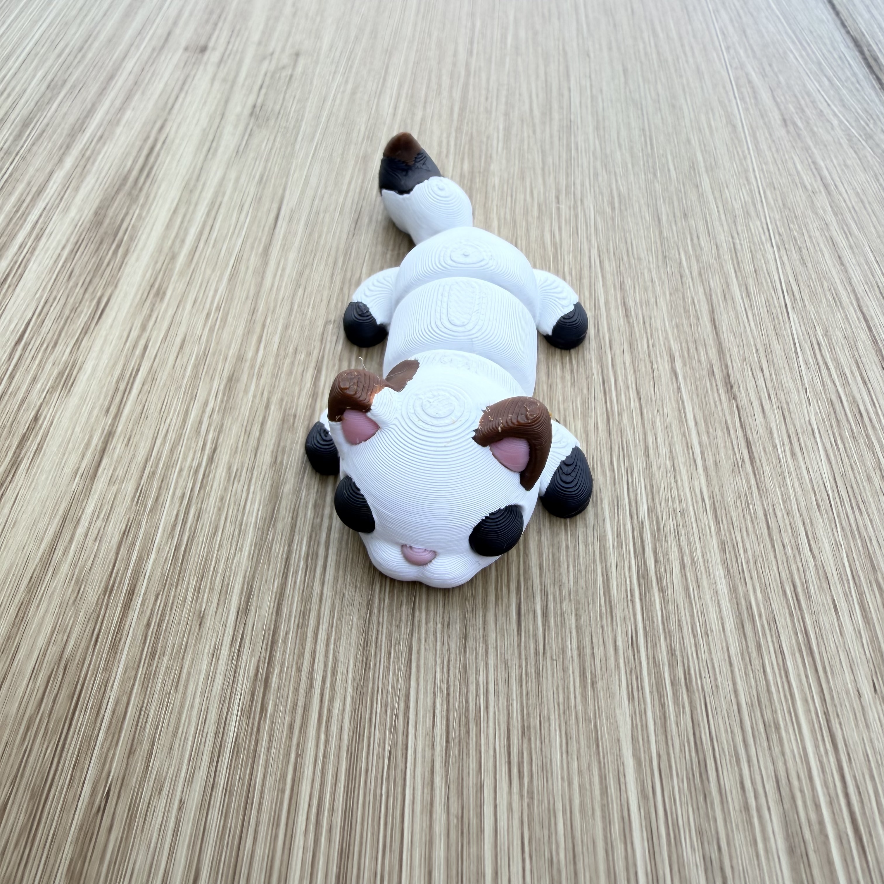 Chat flexi Calico, Figurine